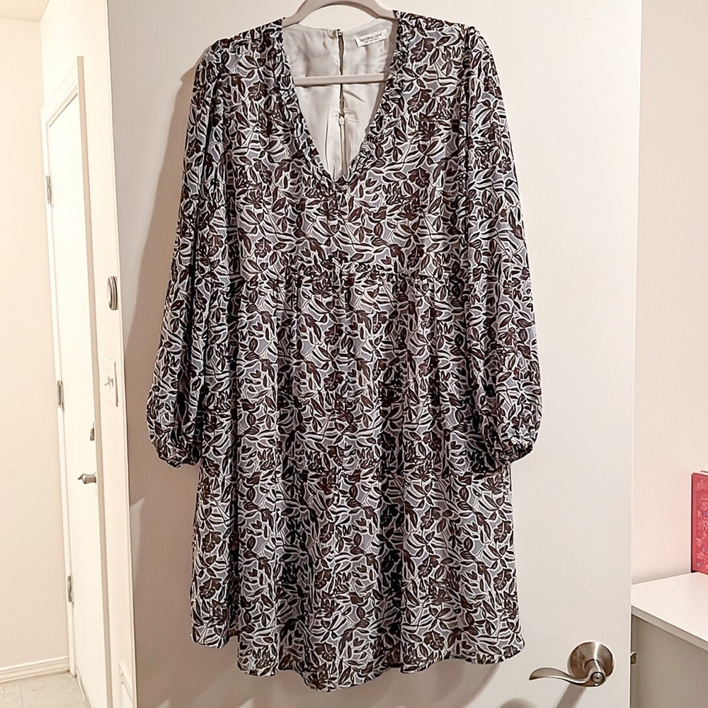 Blue floral 3/4 sleeve dress. Deep V ruffle neck. Size 1X.